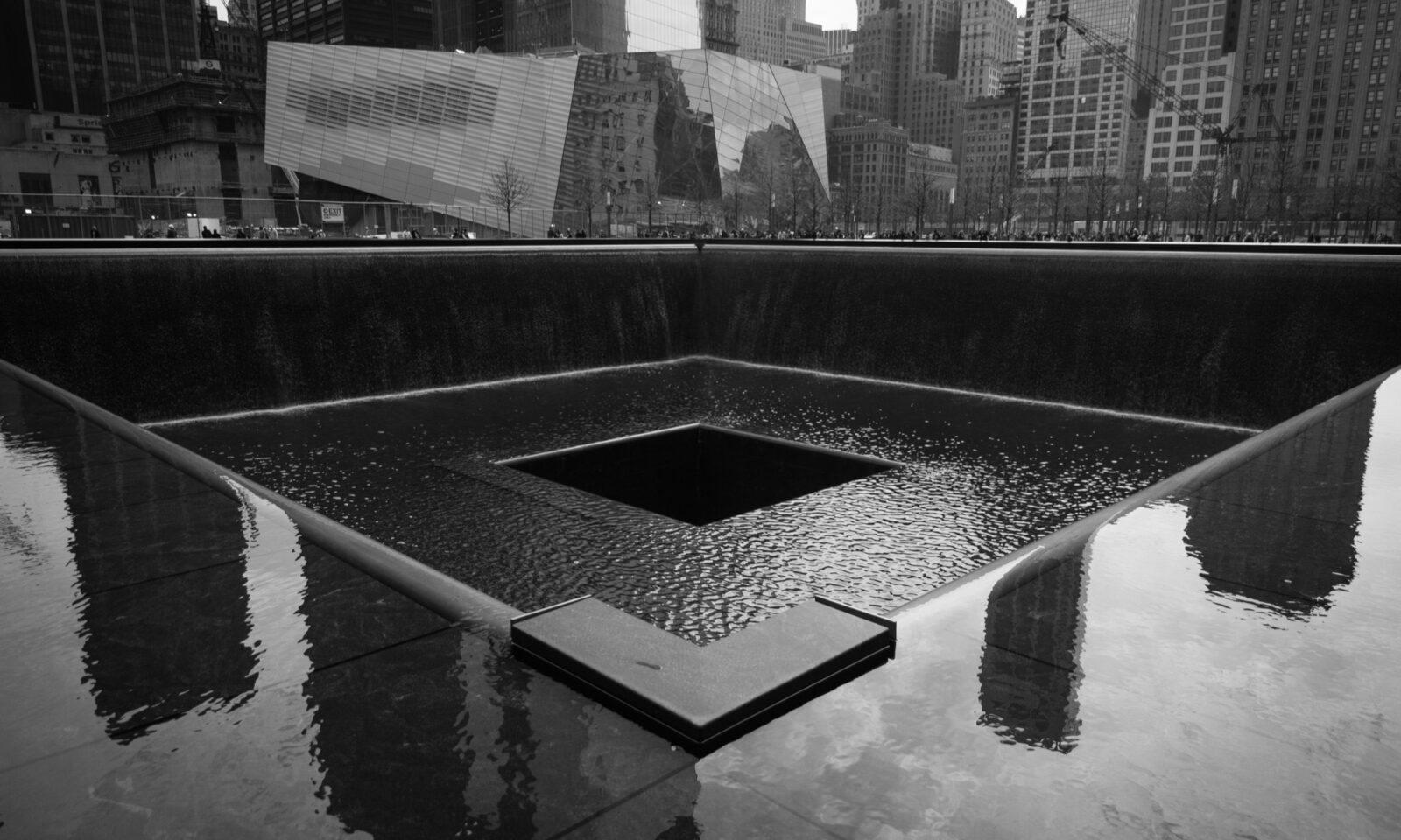 Black-and-white view of the 9/11 Memorial South Pool in New York