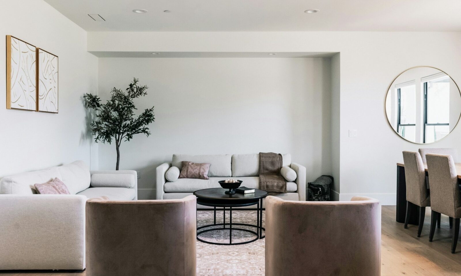 Modern living room with neutral furniture and wall art