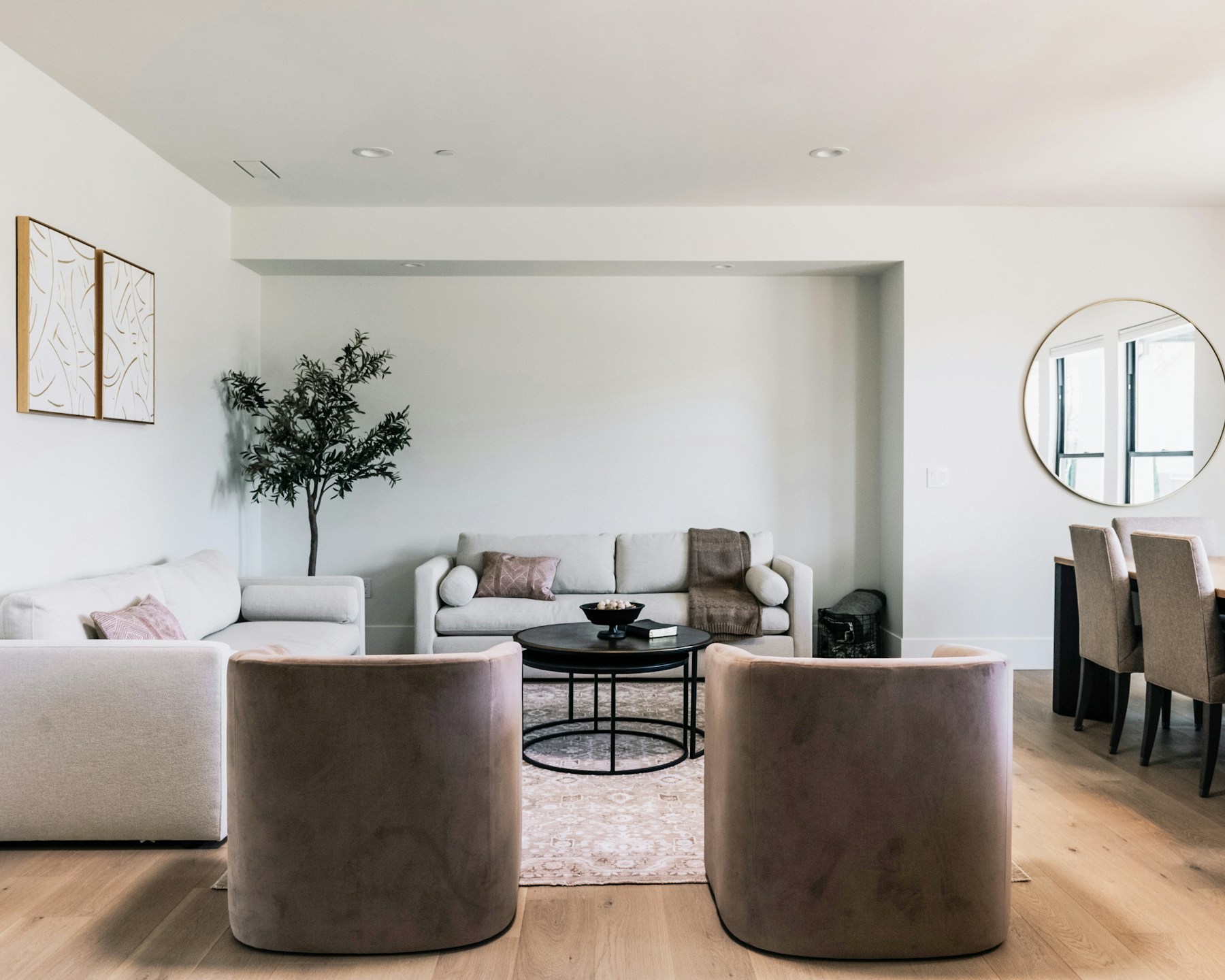Modern living room with neutral furniture and wall art
