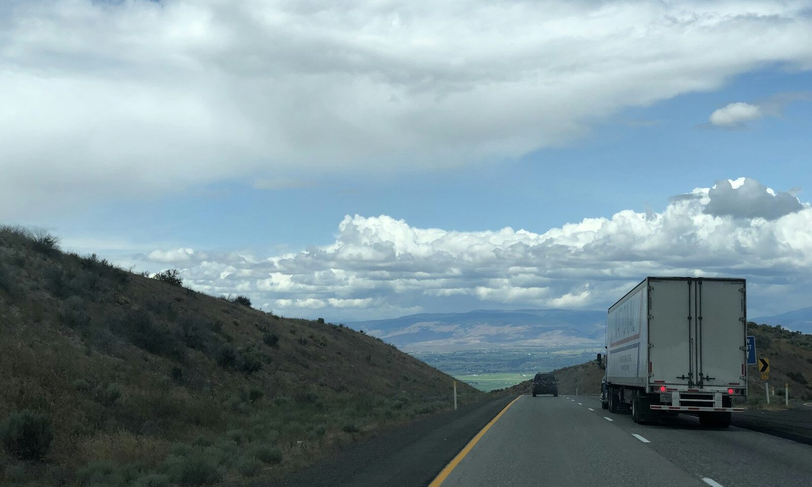 Freight truck traveling along a highway