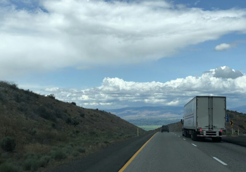 Freight truck traveling along a highway