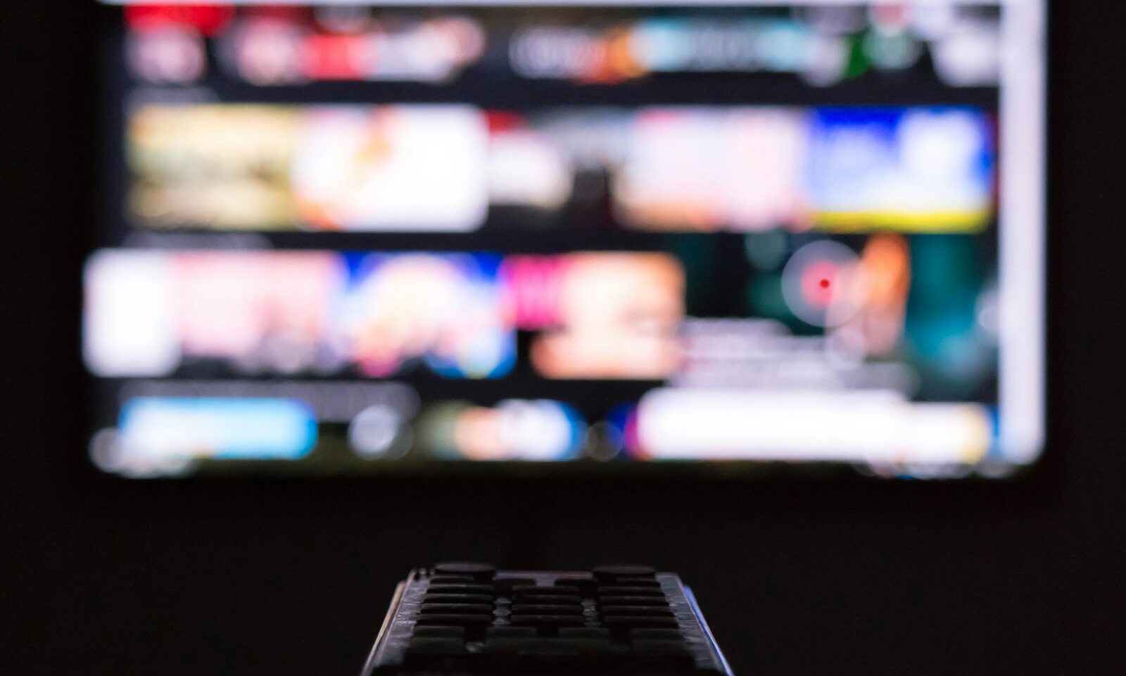 Remote control in front of a television screen