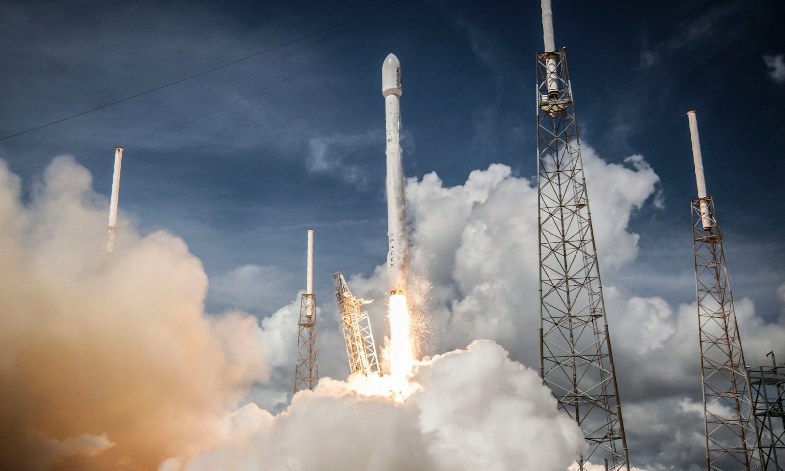 Rocket launching above a plume of white smoke at Cape Canaveral, illustrative image