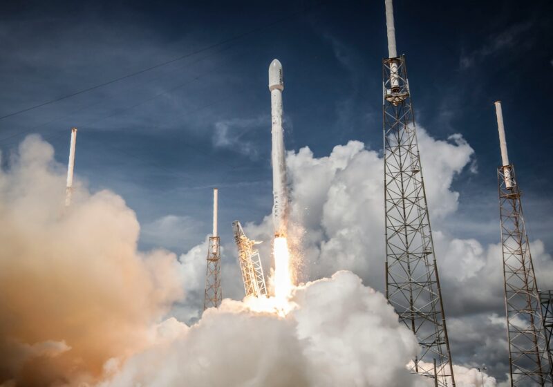 Rocket launching above a plume of white smoke at Cape Canaveral, illustrative image