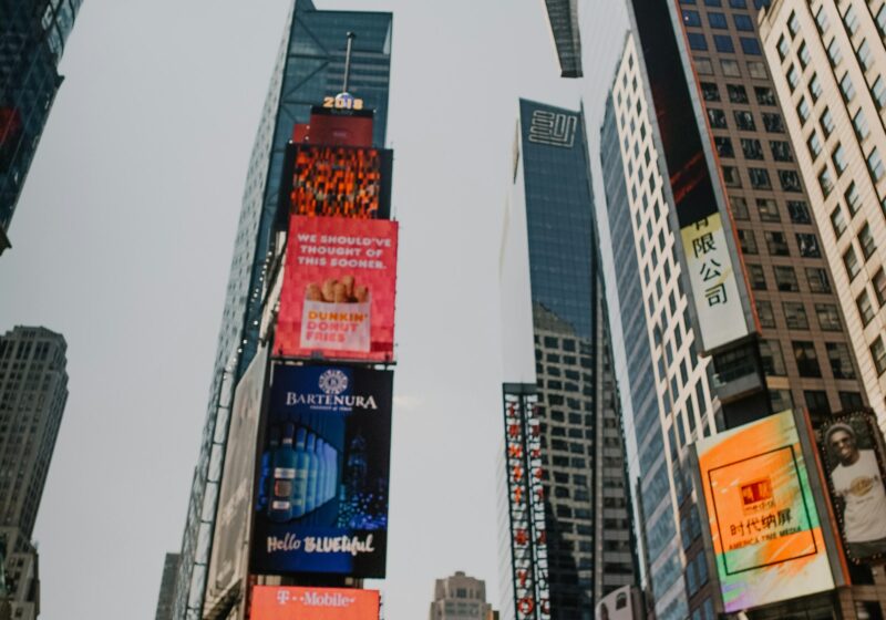 Electronic advertising billboards mounted on tall city buildings