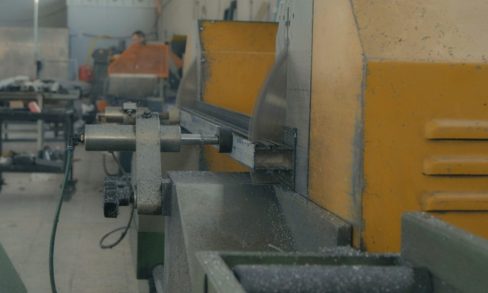 Industrial metal-cutting machinery with metal shavings in a workshop
