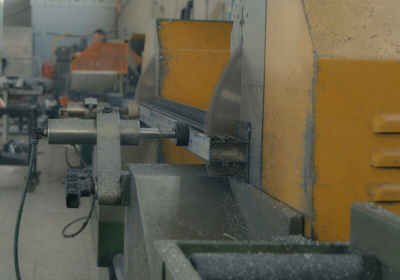 Industrial metal-cutting machinery with metal shavings in a workshop