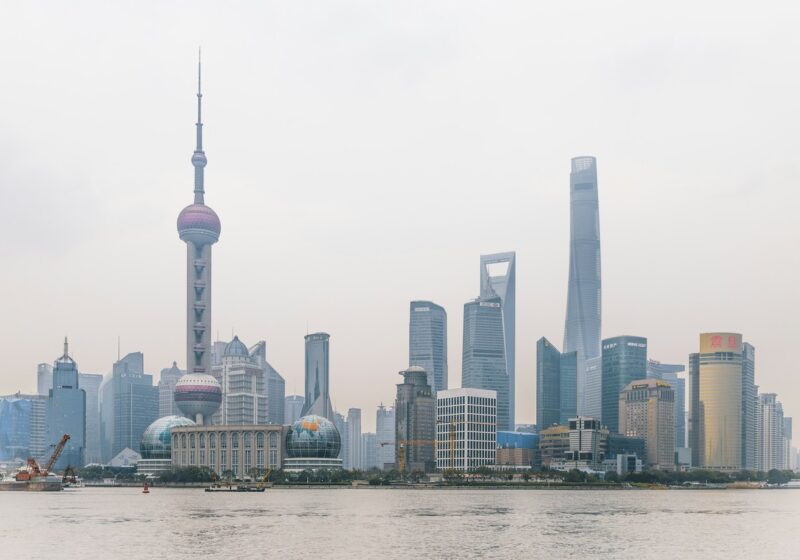 Shanghai skyline across the Huangpu River, including the Oriental Pearl Tower